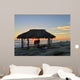 Silhouette of women under a beach shack in La Jolla, California.  Wall Mural