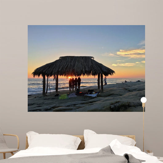 Silhouette of women under a beach shack in La Jolla, California.  Wall Mural