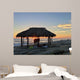 Silhouette of women under a beach shack in La Jolla, California.  Wall Mural