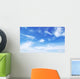 Blue sky background with tiny clouds Wall Mural