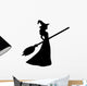 Young witch with a broom silhouette Wall Decal