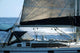 sailboat with a whale splash in background Wall Mural