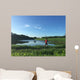 Male runner on path around lake Wall Mural