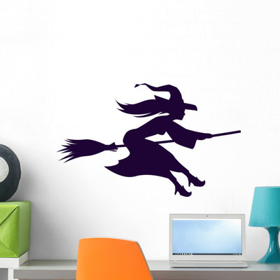Broomstick Riding Halloween Witch Wall Decal shown on a wall