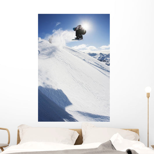 Professional Snowboarder Making Jump Wall Decal