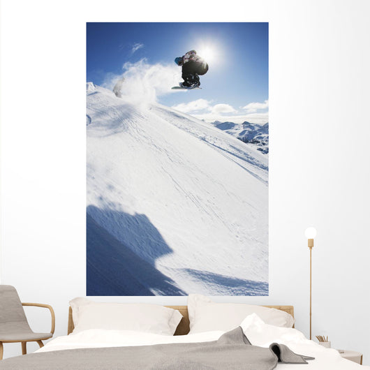 Professional Snowboarder Making Jump Wall Decal