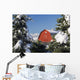 Snow covered red barn, evergreens, mountains Wall Mural