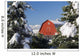 Snow covered red barn, evergreens, mountains Wall Mural