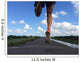 Rear view of man running and jumping down a path on blue sky day Wall Mural