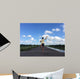 Man running away fast downhill Wall Mural