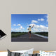 Man running away fast downhill Wall Mural