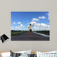 Man running away fast downhill Wall Mural