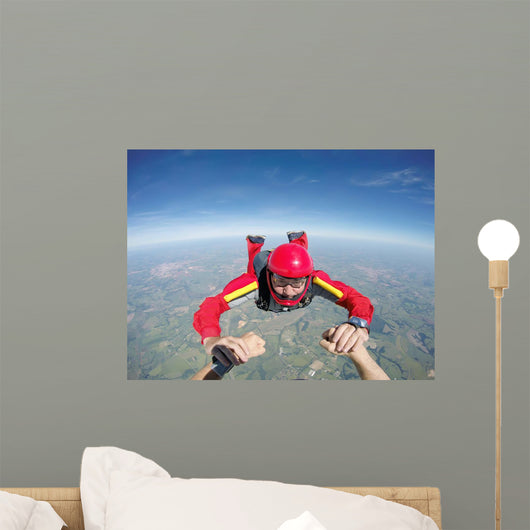 Skydiving senior man holding hands Wall Mural