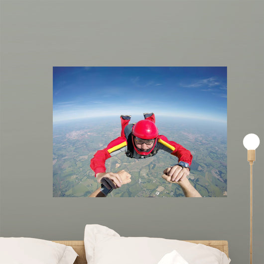 Skydiving senior man holding hands Wall Mural