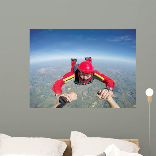 Skydiving senior man holding hands Wall Mural