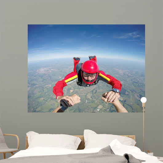 Skydiving senior man holding hands Wall Mural