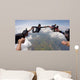 A group of friends holding hands teamwork skydiving Wall Mural