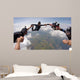 A group of friends holding hands teamwork skydiving Wall Mural