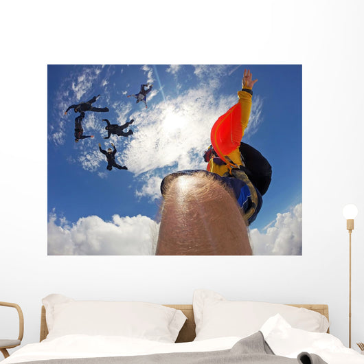 Point of view of a camera attached in the leg of the skydiver Wall Mural