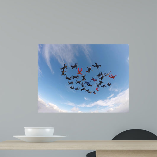 Skydiving people low angle view Wall Mural