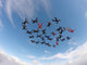 Skydiving people low angle view Wall Mural