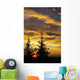 Silhouette of two evergreen trees, sunrise Wall Mural
