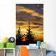 Silhouette of two evergreen trees, sunrise Wall Mural