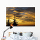 Silhouette of two evergreen trees, sunrise Wall Mural