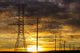 Silhouette of large metal powerline towers Wall Mural