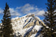 Snow covered mountain, evergreen trees Wall Mural