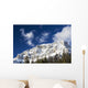 Snow covered mountain peak, blue sky, clouds Wall Mural