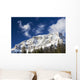 Snow covered mountain peak, blue sky, clouds Wall Mural