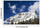 Snow covered mountain peak, blue sky, clouds Wall Mural