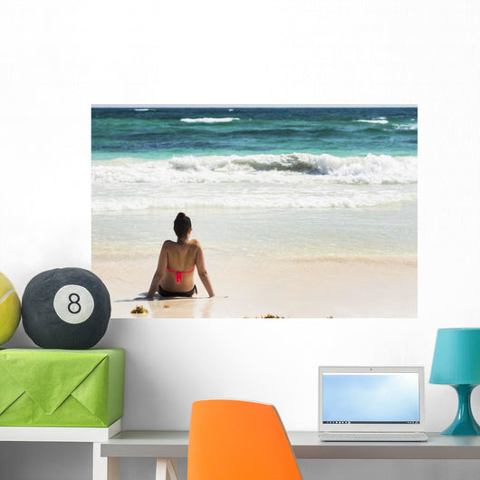 Young Woman Sitting Sandy Wall Decal