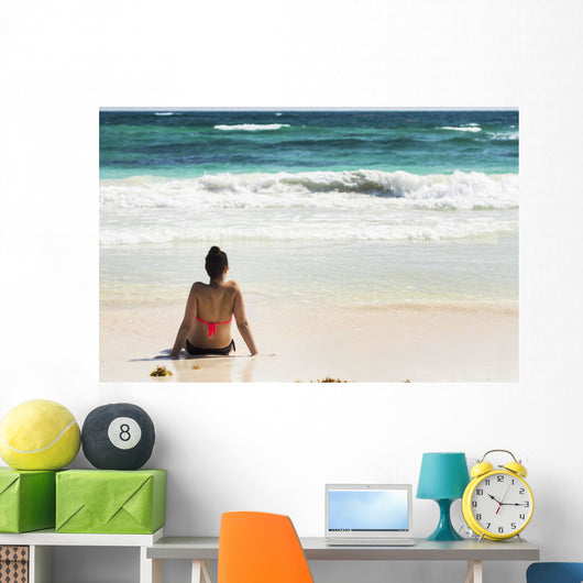 Young Woman Sitting Sandy Wall Decal