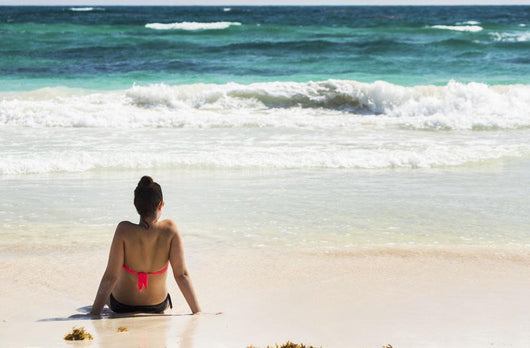 Young Woman Sitting Sandy Wall Decal