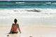 Young Woman Sitting Sandy Wall Decal