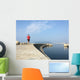 Man running along harbor sea wall Wall Mural