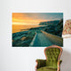 Senja island at orange sunset. Wooden pathway on the rocky beach Wall Mural