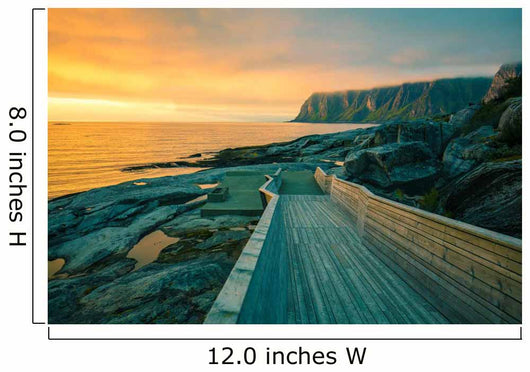 Senja island at orange sunset. Wooden pathway on the rocky beach Wall Mural