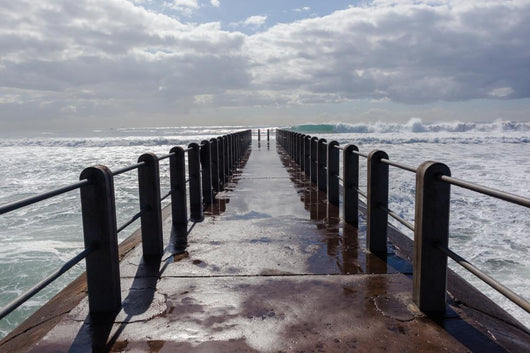 Beach Pier Waves ocean storm swells crashing water power Wall Mural