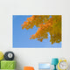 yellow and orange leaves against blue sky Wall Mural