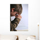 young boy praying over his bible Wall Mural