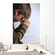 young boy praying over his bible Wall Mural