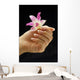 female hand holding flower Wall Mural