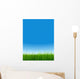 green grass over a clear blue sky without clouds as background Wall Mural