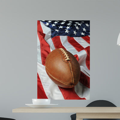 Football against American Flag Wall Mural shown on a wall
