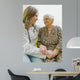 Old woman and yung doctor Wall Mural