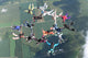 16 skydivers in formation Wall Mural