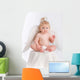 Adorable baby with angel wings on white Wall Decal